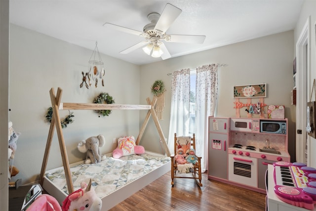 bedroom featuring dark wood-type flooring and ceiling fan