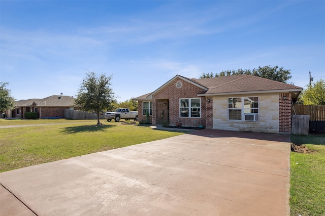 single story home with a front lawn