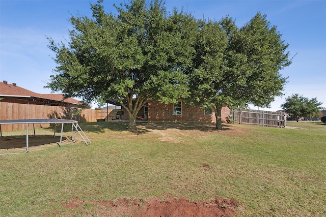 view of yard with a trampoline