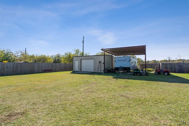 view of yard with an outbuilding and a garage