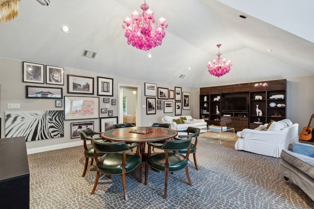 dining room featuring vaulted ceiling and an inviting chandelier