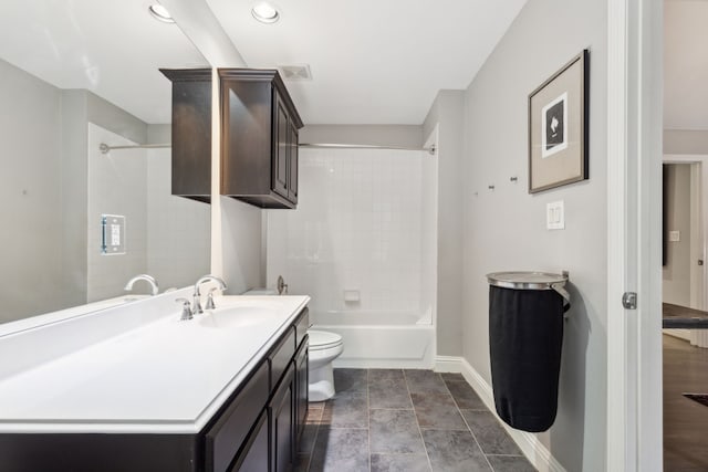 full bathroom with toilet, vanity, and tiled shower / bath combo