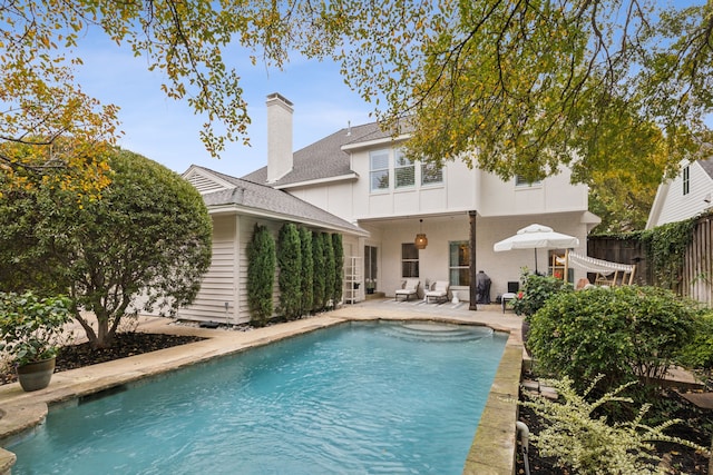 view of swimming pool with a patio