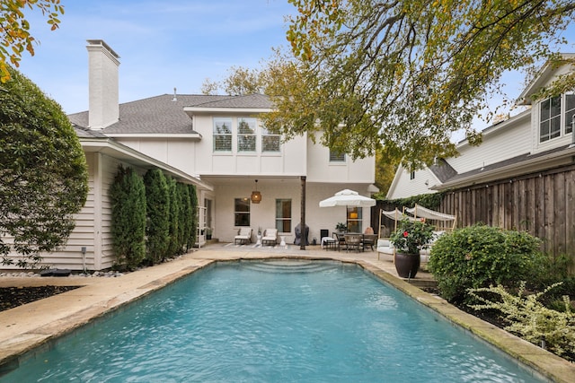 view of swimming pool with a patio area