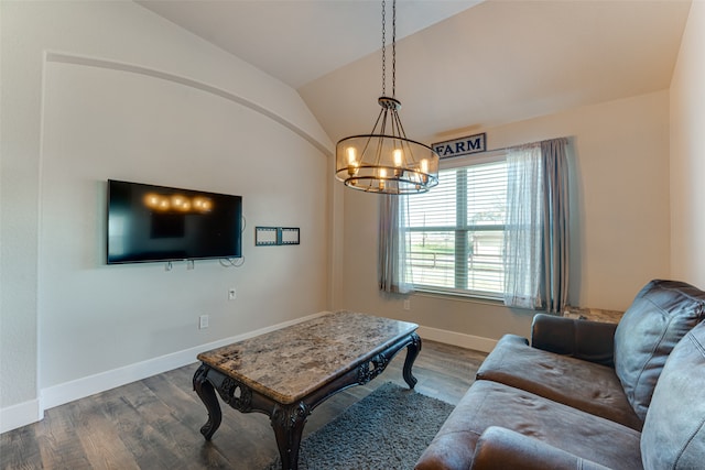 living room with an inviting chandelier, lofted ceiling, and wood-type flooring