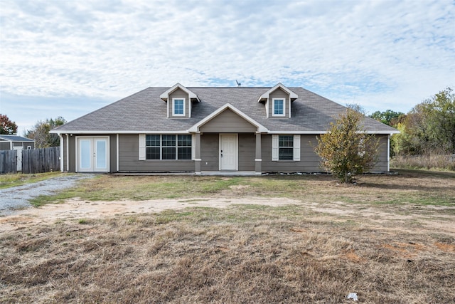 view of front facade featuring a front yard and french doors