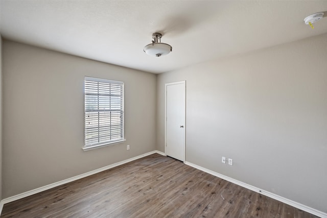 empty room with hardwood / wood-style floors