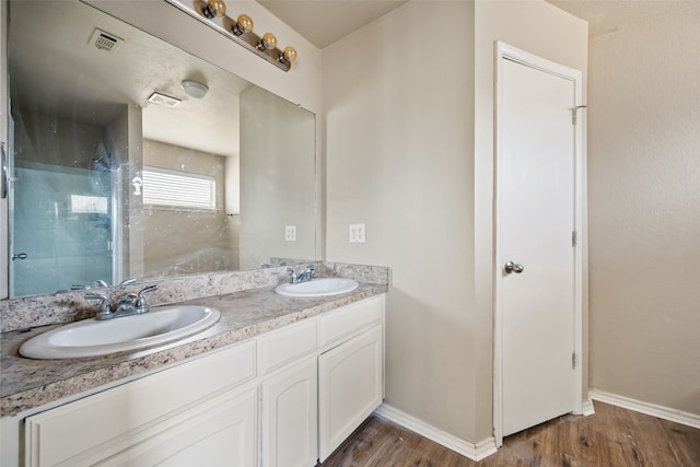 bathroom featuring vanity and wood-type flooring