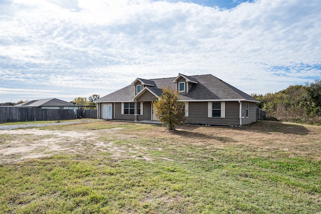 view of front of home featuring a garage and a front lawn