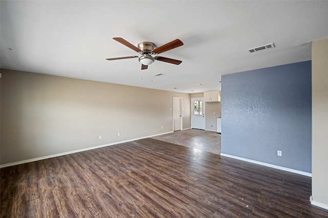 empty room featuring ceiling fan and dark hardwood / wood-style floors