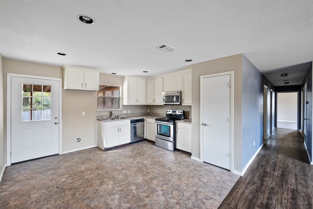 kitchen with white cabinets, stainless steel appliances, and sink