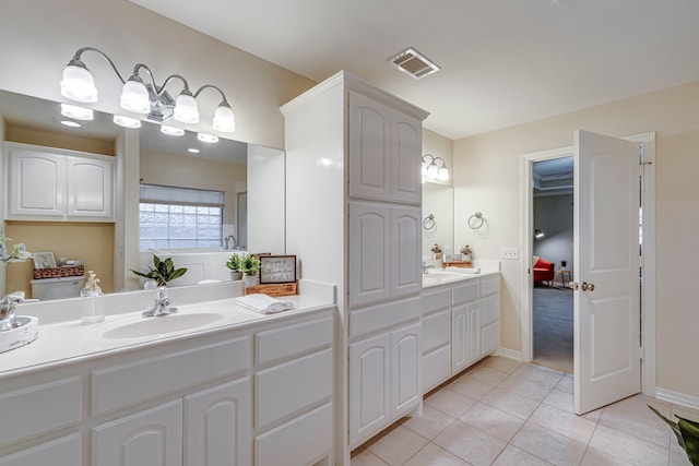 bathroom with tile patterned floors and vanity