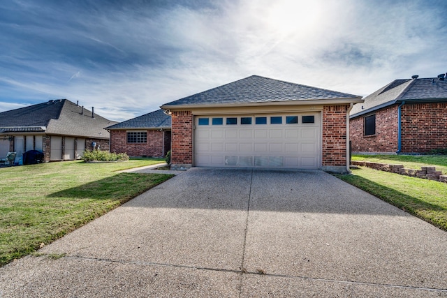 view of front of home with a front yard and a garage