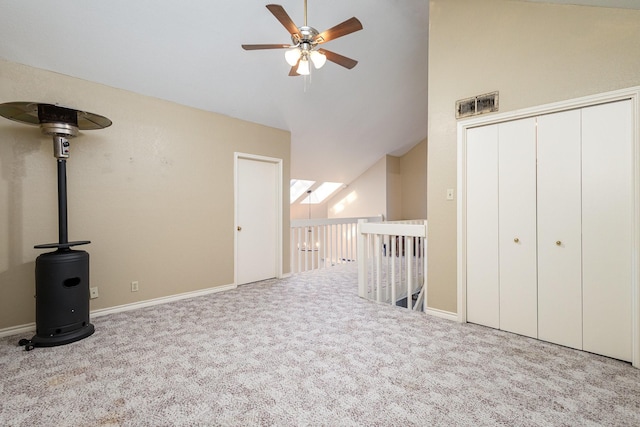 interior space with light carpet, high vaulted ceiling, and ceiling fan