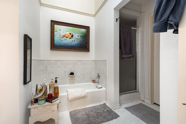 bathroom with shower with separate bathtub