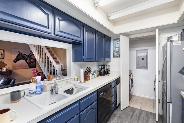 kitchen with blue cabinetry, stainless steel fridge, dark wood-type flooring, and black dishwasher