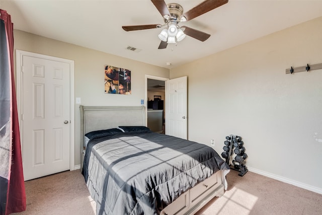 carpeted bedroom with ceiling fan