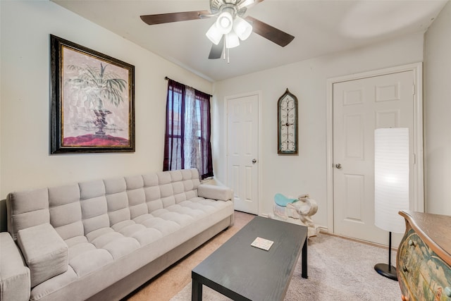 living room featuring carpet floors and ceiling fan