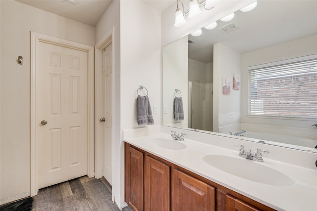 bathroom with vanity, separate shower and tub, and wood-type flooring