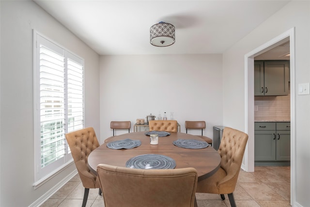 dining area featuring plenty of natural light and light tile patterned floors