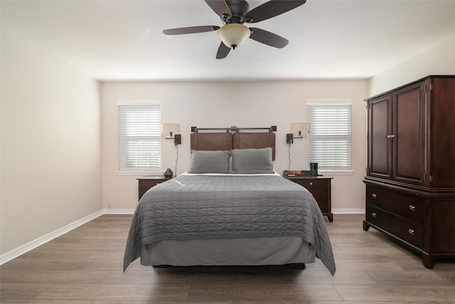 bedroom featuring ceiling fan and light hardwood / wood-style floors