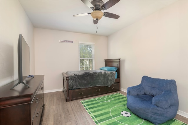 bedroom with ceiling fan and light hardwood / wood-style flooring