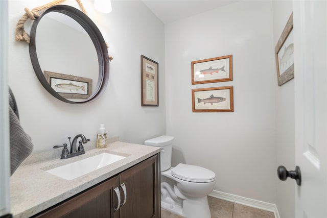 bathroom with tile patterned floors, vanity, and toilet