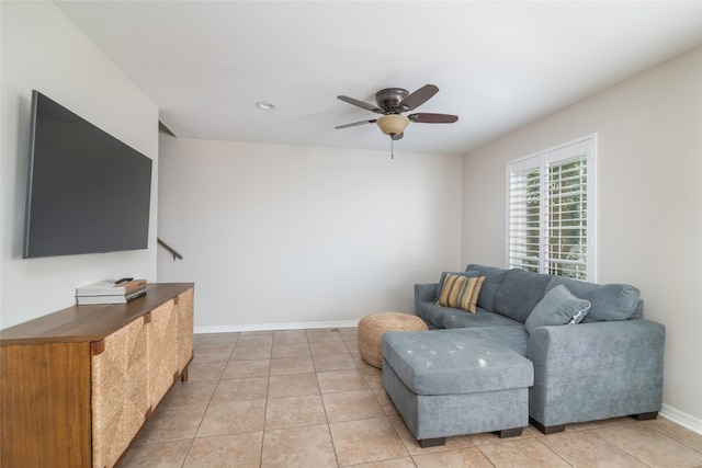 tiled living room with ceiling fan