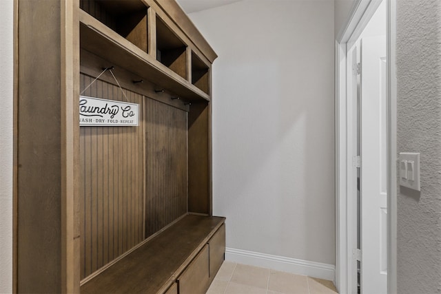 mudroom with light tile patterned flooring