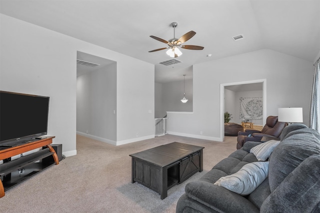 living room featuring vaulted ceiling, ceiling fan, and carpet flooring