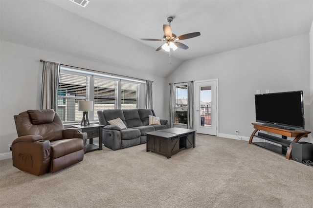 carpeted living room featuring ceiling fan and lofted ceiling