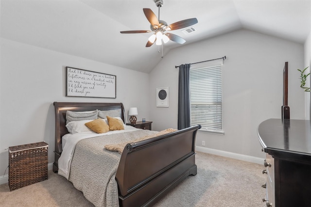 carpeted bedroom with ceiling fan and lofted ceiling