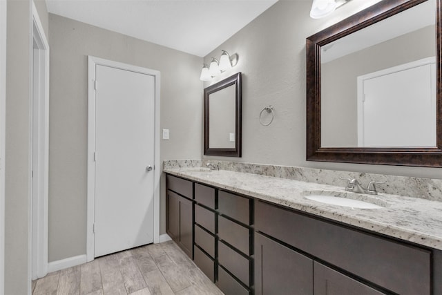 bathroom featuring vanity and wood-type flooring