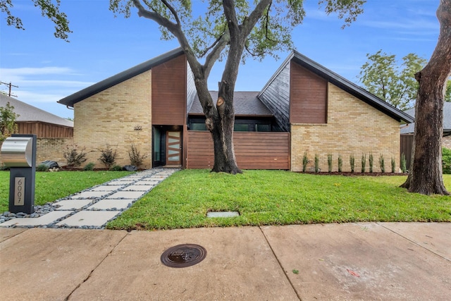 modern home featuring a front yard