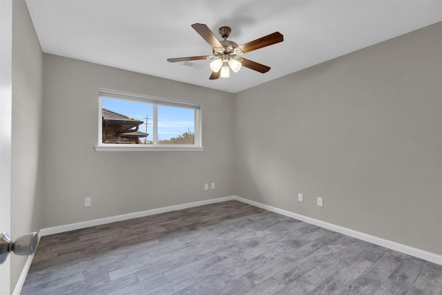 unfurnished room featuring ceiling fan and wood-type flooring