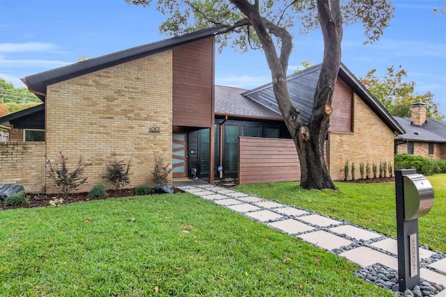 view of front of home with a front yard