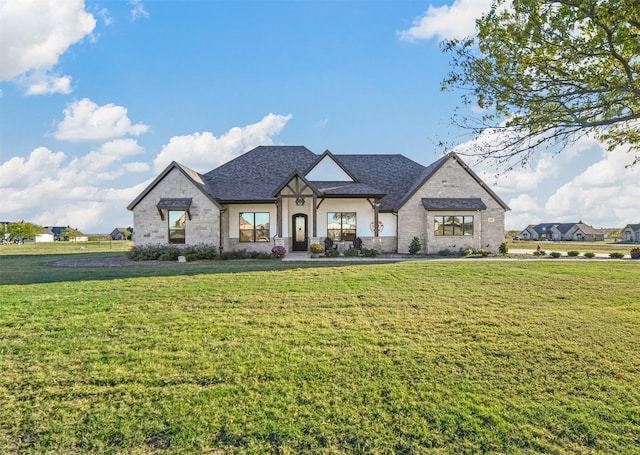 french country style house featuring a front yard