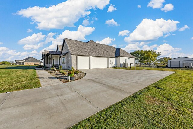 view of front of house with a front lawn and a garage