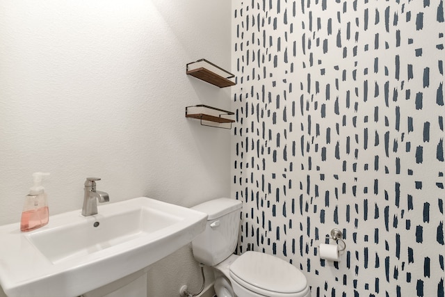 bathroom featuring sink and toilet