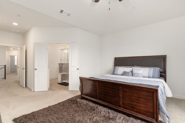 bedroom with connected bathroom, ceiling fan, and light carpet