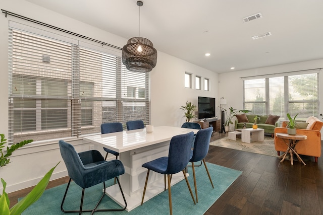 dining space with dark wood-type flooring