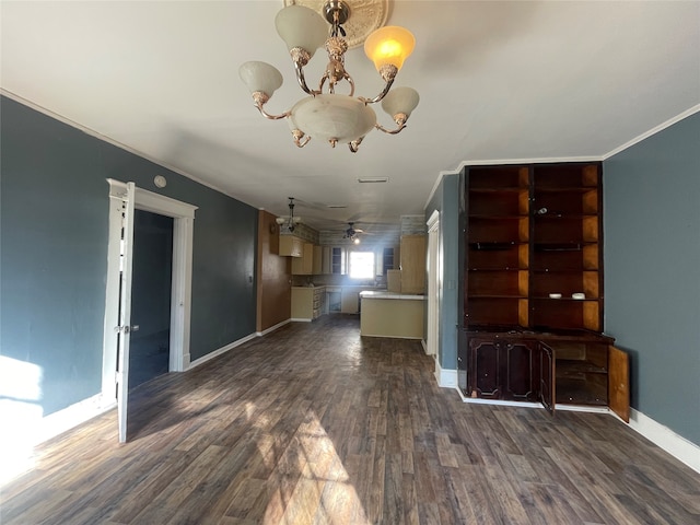 unfurnished living room featuring ceiling fan with notable chandelier, dark hardwood / wood-style flooring, and crown molding