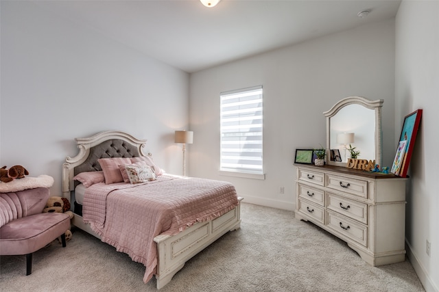 bedroom with light colored carpet