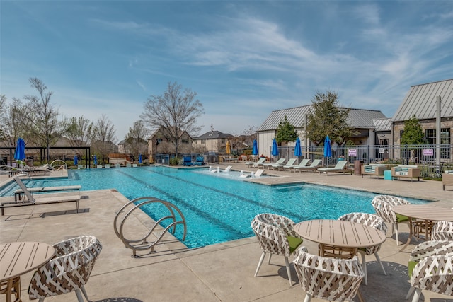 view of swimming pool featuring a patio