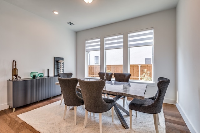 dining room featuring hardwood / wood-style flooring and plenty of natural light