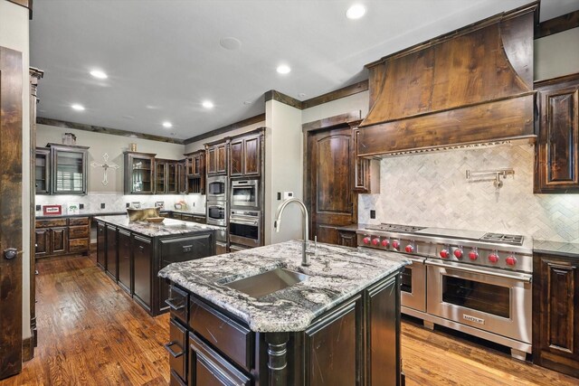 5101 Hells Gate Loop, Possum Kingdom Lake, TX 76475 - kitchen featuring a kitchen island, crown molding, stainless steel built in fridge, a sink, and wood finished floors