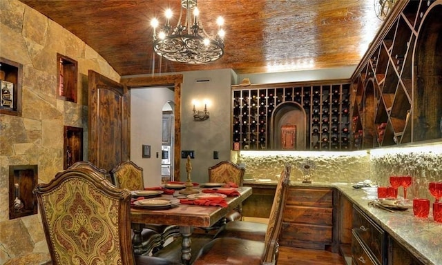 wine room featuring wood ceiling and lofted ceiling