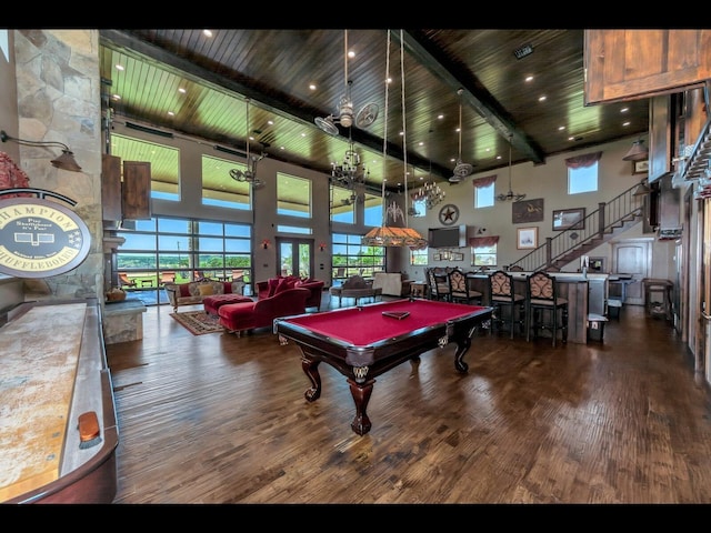 rec room with hardwood / wood-style flooring, a wealth of natural light, wooden ceiling, and beamed ceiling