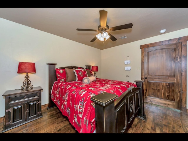 bedroom featuring dark wood-type flooring and ceiling fan