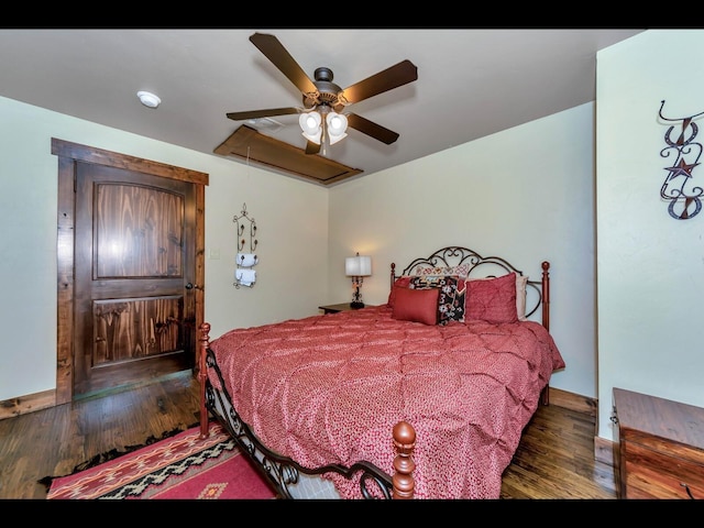 bedroom with dark wood-type flooring and ceiling fan